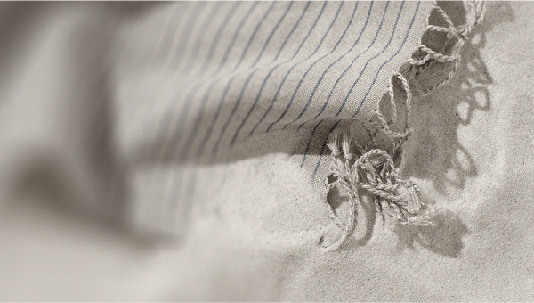 Beach towel on the sand Tips to make your tan last longer